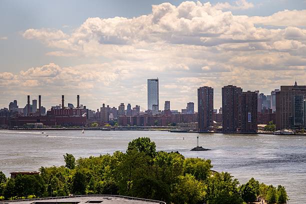 istock New York City skyline with river and trees. 2218586513