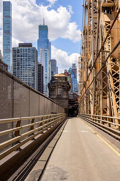 istock Queensboro Bridge walkway with Manhattan skyline. 2218586544
