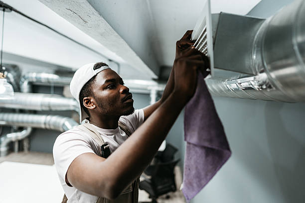 istock Skilled technician adjusts air vent in modern indoor space during maintenance inspection 2218587502