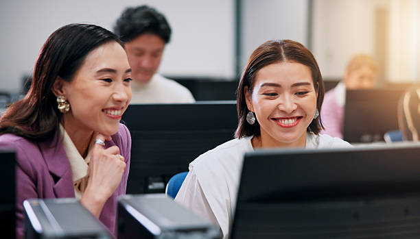 istock Creative, women and coworking in office, computer and collaboration for public relations and smile. Reading, colleagues and planning for ad campaign, media coordinator and market research 2218588331