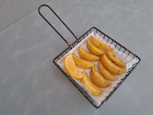Crispy Potato Wedges In Basket. Snack Menu.