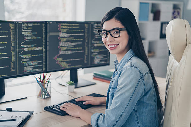 istock Photo of successful lady editor sit desk use gadget web html page content improving in light workspace 2218594222