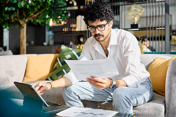 istock Male business professional analyzing sales report 2218600050