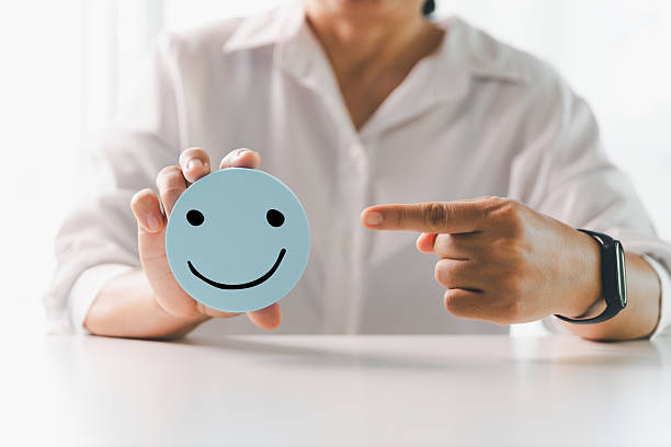 istock Client show feedback, smiley face sign. Service rating, satisfaction concept. happy smile face, good feedback rating, positive customer review, experience, satisfaction survey, smiley mental health. 2218600311