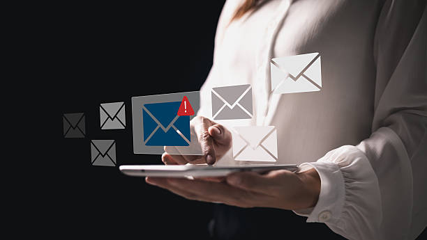 istock Phishing email alert concept with person using smartphone while surrounded by warning icons symbolizing scam messages cyber threats digital communication security risks. electronic mail alert phishing 2218600516