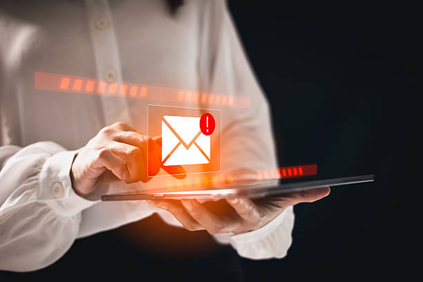 istock Phishing email alert concept with person using smartphone while surrounded by warning icons symbolizing scam messages cyber threats digital communication security risks. electronic mail alert phishing 2218600698