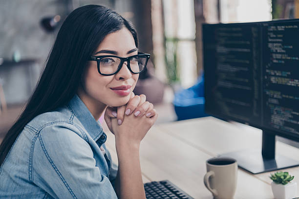 istock Profile side view portrait of attractive educated girl technician editing database css solving task at workplace workstation indoors 2218600813