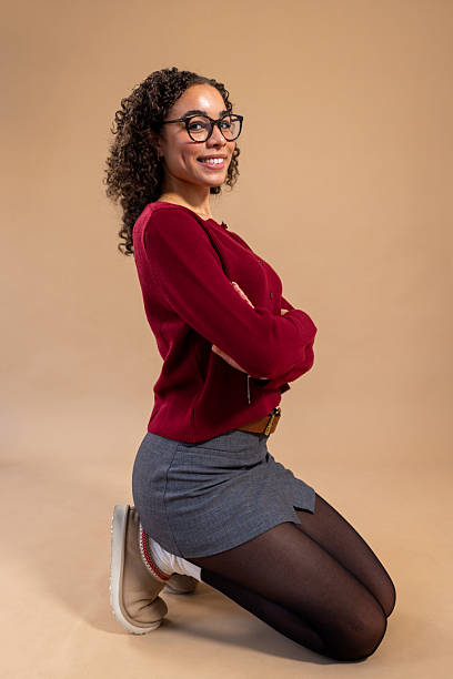 istock Smart Young Woman Smiling in the Studio 2218605150