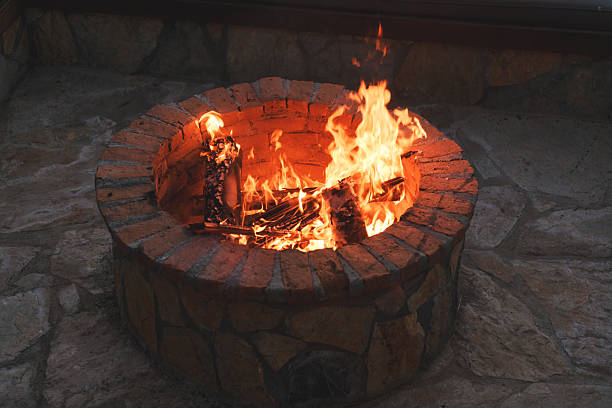istock A warm fire burns in a stylish fire pit at a luxury hotel, creating an inviting evening ambiance. 2218606558