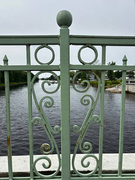istock Green cast iron support of the old bridge 2218606560