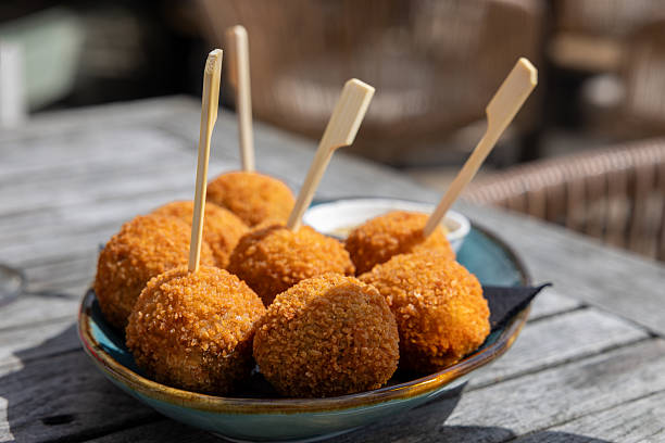 istock Dutch bitterbal in a bowl; traditional fried pub snack appetizer with mustard 2218606823