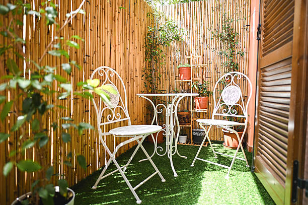 istock Cozy balcony decorated with bamboo and plants 2218609523