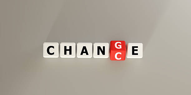 Blocks spelling CHANGE with a red letter block. Symbolizes transformation, transition, and evolution in business and life. Ideal for concepts of adaptation, growth, new beginnings, future direction.