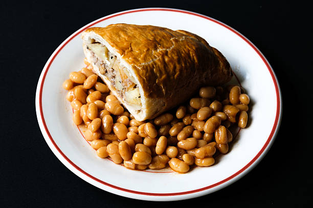 London UK, June 04 2025, Classic Cooked Cornish Pasty Meal With Baked Beans