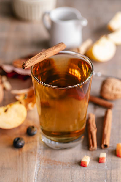 Close up of a glass filled with cinnamon tea