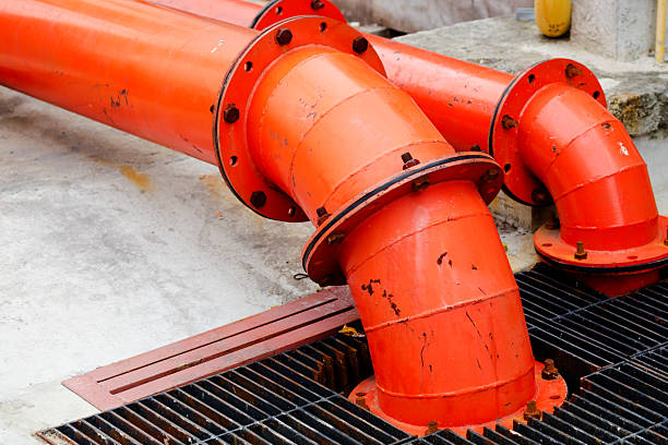 Orange colored water pump station pipes in Bangkok Ladprao