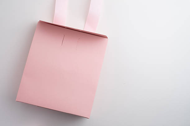 istock Pink box with pink ribbon on white background. Space for text and logo. Gift wrapping 2218618850