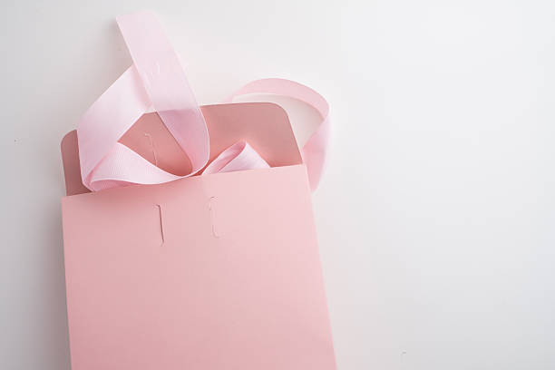 istock Pink box with pink ribbon on white background. Space for text and logo. Gift wrapping 2218618874