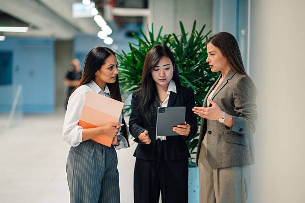 istock Businesswomen collaborating on a digital tablet in modern office 2218621485
