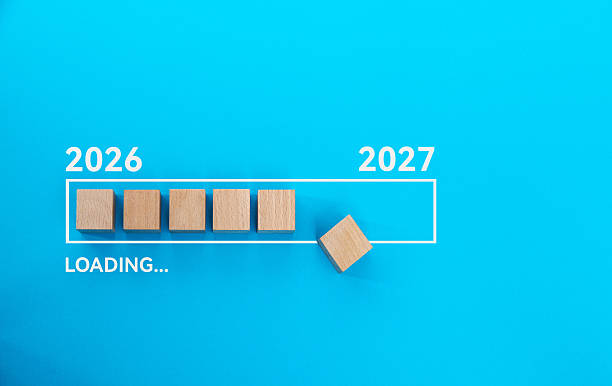 istock Loading bar with wooden blocks 2026 to 2027 on blue background 2218624403
