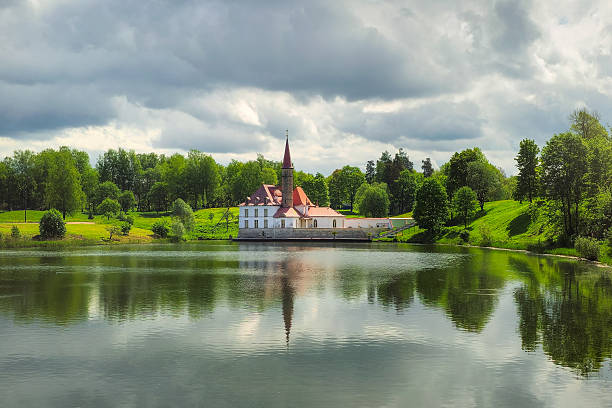 Bright summer landscape with a lake and a Palace. Gatchina. Beautiful landscape with Maltese Palace by the water.