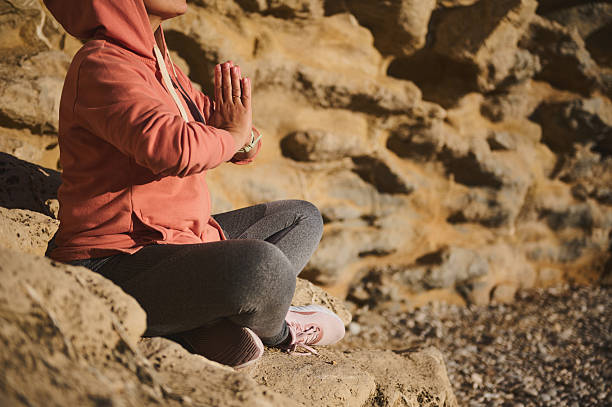 istock Woman Practicing Mindful Yoga Outdoors Amidst Scenic Rocky Terrain 2218629486