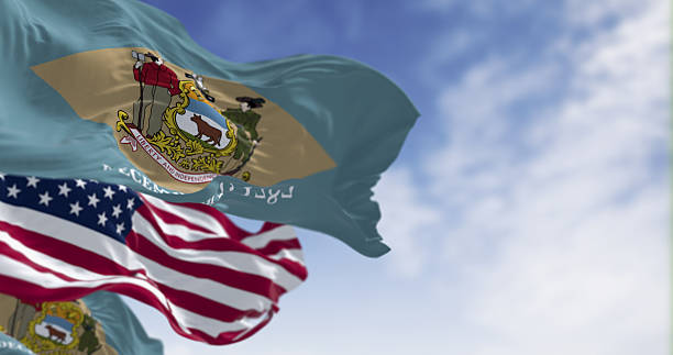 istock Delaware state flags waving with the national american flag 2218630088