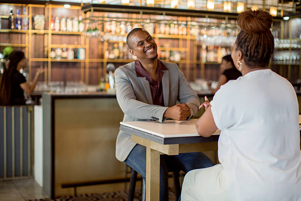 istock Romantic couple sitting at the bar 2218630846
