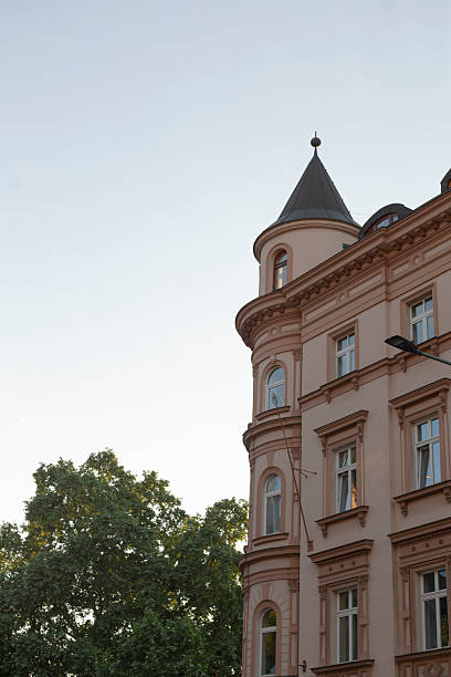 istock A Historic Building Corner with Tower Set Against a Clear Blue Sky 2218636715