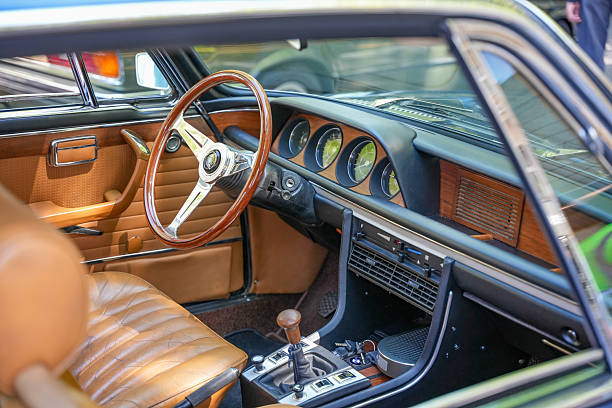 A clear windshield of a red sports car.