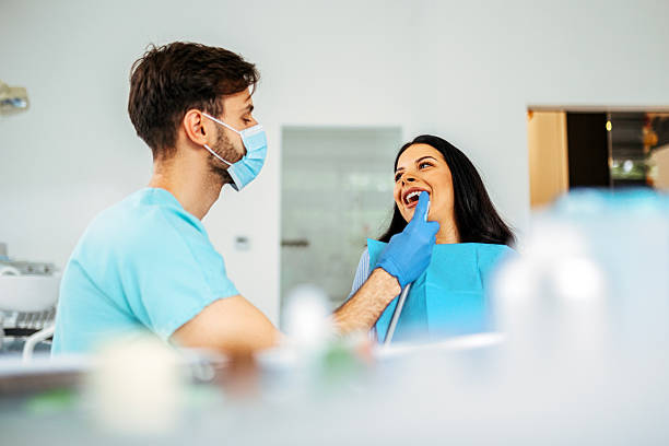 istock Friendly Dental Visit with Happy Dentist and Patient 2218643011