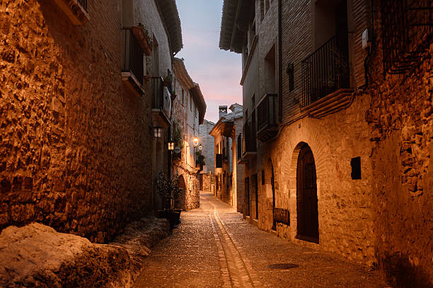 A street in Alquezar, named one of the most beautiful villages in Spain, at night. Huesca province, Aragon, Spain.