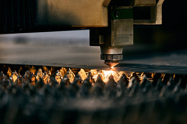 Modern Industrial Laser Cutting Machine with Sparks in Factory Setting