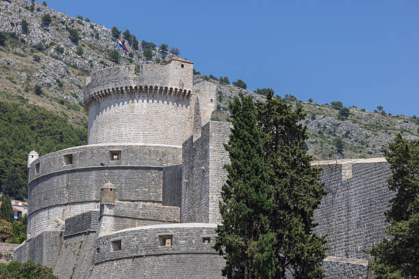 Minceta, fortified tower on City Walls surrounding the mediaval old city by Adriatic Sea, Dubrovnik, Croatia Dubrovnik, Croatia - June 27, 2023: Minceta, fortified tower on City Walls surrounding the medieval old city by Adriatic Sea. Old Town with historical center is known as pearl of Dalmatia fort minceta dubrovnik stock pictures, royalty-free photos & images