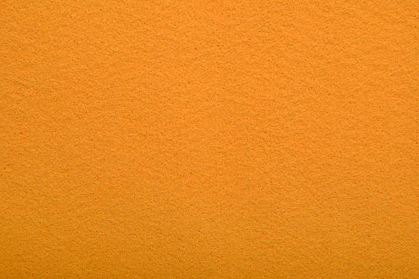 istock Orange felt texture background - close-up of soft fabric surface. Seamless background, graphic design, scrapbooking, textile layouts, creative projects. 2218647475