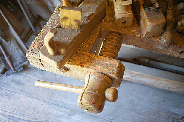 istock A wooden workbench with a hammer and a saw on it 2218648619