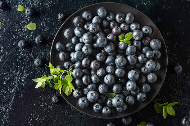 istock Blueberries in a black plate on a dark background. 2218648949