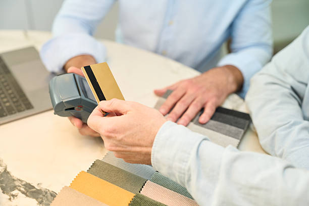 istock Customer paying with credit card for interior design services 2218649571