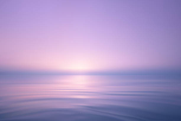 istock Dreamy ocean scene with soft pink purple sunrise 2218650460