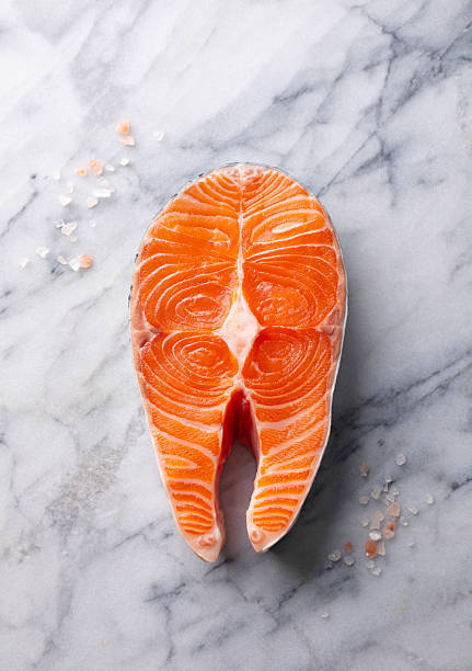 Fresh Salmon Steak. Marble background. Top view.