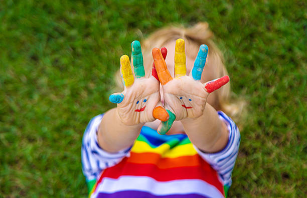 Child in hand draw smile. Selective focus.