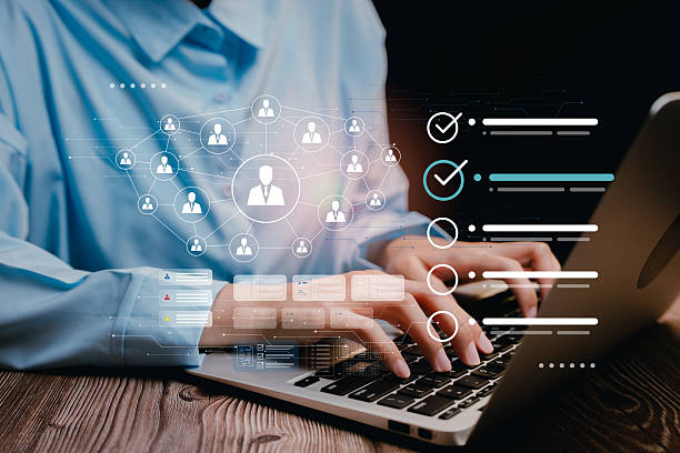 istock CRM Concept. Businessman typing on laptop with digital network connection and data analysis interface overlay 2218654604