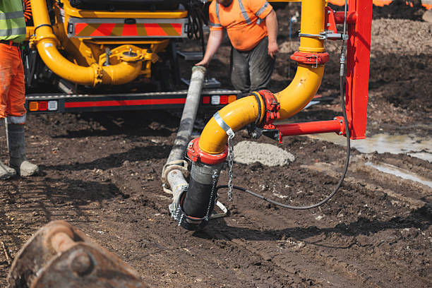 istock Close-up of mobile concrete pump pipes on construction site 2218654899