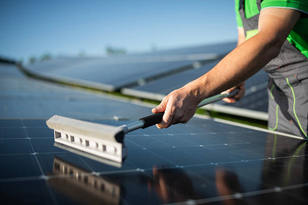 istock Close up of worker cleaning photovoltaic panel system. 2218657801