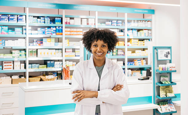 istock Confident pharmacist smiling with crossed arms in pharmacy 2218658458