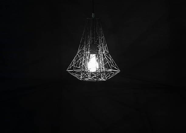 modern abstract geometric black chandelier on dark background