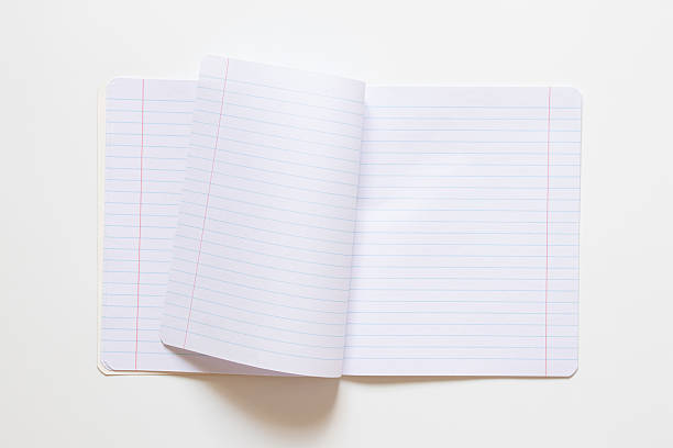 istock One notebook in a line, fastened with staples on a white background, educational background for school 2218659242