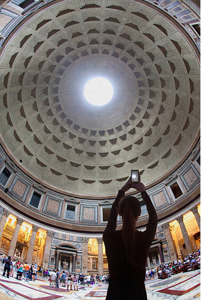 istock The Pantheon monument, female tourist using smart phone 2218659437