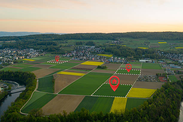 istock Land plot management - real estate concept with a vacant land on a green field available for building construction and housing subdivision in a residential area for sale, rent, buy or investment. 2218659687