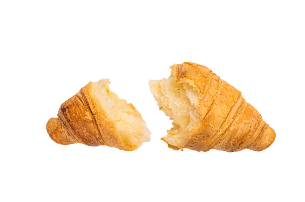istock Broken French croissant  isolated on white background, top view. 2218660844